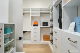 Primary walk-in closet with custom built-ins