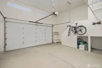 Two-car garage with EV charging and plenty of overhead storage