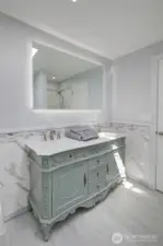 Light-filled primary bathroom with a soaking tub and separate walk-in shower—designed for both relaxation and everyday ease.