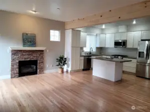 Natural light warms the great room & open gourmet kitchen