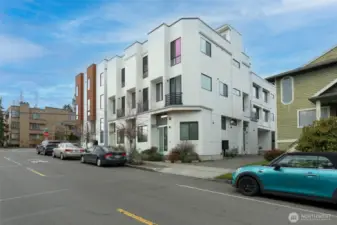 Tucked off the street, welcome to this gorgeous end-unit townhome