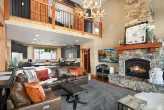 Propane fireplace and another elk antler chandelier make this home so cozy and comfortable.  Surround sound throughout the house as well.  All 5 TVs included in the sale.