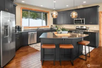 Kitchen cabinets recently painted along with updated hardware and smoked chrome lighting.