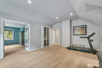 Another view of the bonus room with a view of the "flex space" separated by double doors