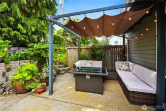 The blend of cozy design and natural beauty makes this patio a true extension of the living space.
