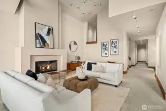 Off the main floor hallway are a bedroom and a quiet office—ideal for guests or working from home.