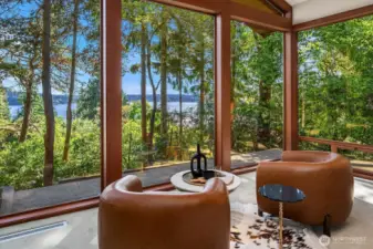 Whether framed by lush summer foliage or the bare branches of winter, the panoramic lake view remains spectacular—and on clear days, even the Olympic Mountains come into sight.