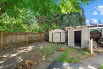 Two storage sheds. One with power and a one car carport