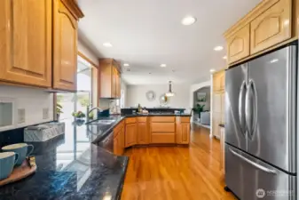 Stainless steel appliances, Gas cooktop w/new down draft fan, wall oven, microwave nook, roll up appliance cabinet, bright lighting ...