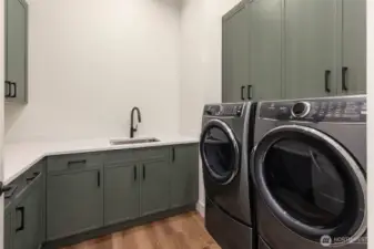 large laundry with lots of storage.