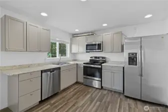 Remodeled kitchen with updated cabinetry and countertops
