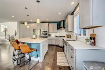 Large main kitchen sink, lots of countertop space, and ample cabinetry