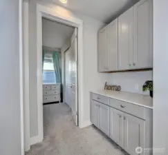 Built-in cabinetry and counter space in the hallway close to the upstairs bedrooms