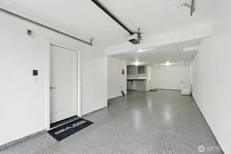 Workbench or storage space in addition to space for 2 cars. The chest freezer stays with the home.