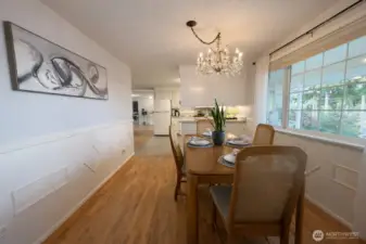Lots of room for company in this dining room, adjacent to the kitchen and living room