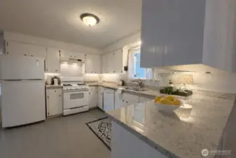 A bright and light kitchen with a view from your window