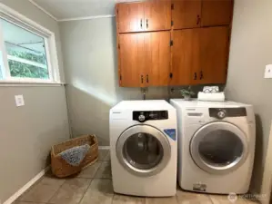 Ample laundry room with storage
