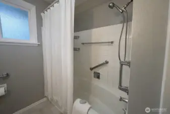 Your main bath is equipped with grab bars and is spacious with extra storage