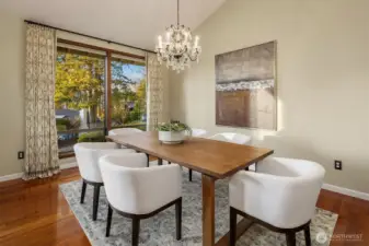 The Dining Room is incredibly elegant with vaulted ceiling, chandelier and floor to ceiling glass windows to take in the view.