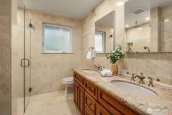 Fully remodeled bathroom,conveniently located on the main floor near the bedrooms, it has an easy step in shower which is a good size with double vanities and heated towel rack