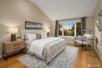 The Primary Bedroom also has a vaulted ceiling and gorgeous west facing views.