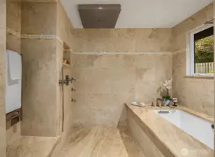 Heated towel rack, luxurious jetted tub and overhead rain shower.