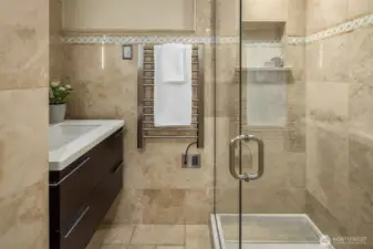 Fully remodeled lower level bathroom is stylish with step in shower too.