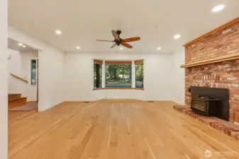 Large Living Room with Engineered hardwood floors and wood fireplace