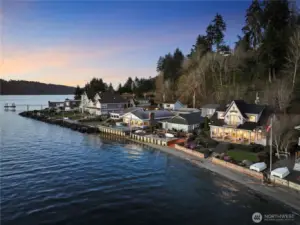 Beautiful shoreline perspective highlighting the home’s exceptional waterfront location.