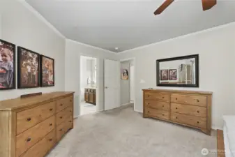 Primary suite can easily accommodate king-size furniture and multiple dressers.