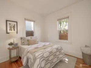 One of two spacious light filled bedrooms on the main floor. Both have generous closet space.