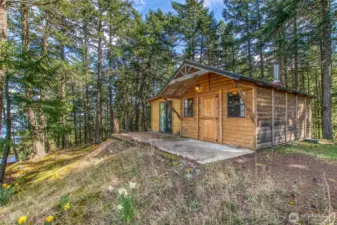 A sweet and simple 360 sq ft two-room cabin with its own bathroom—perfect as a guest space or studio.