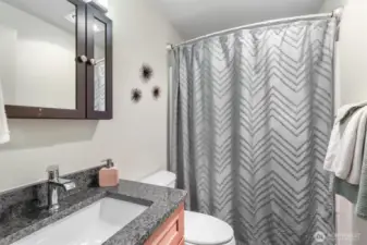 Your bathroom includes a combination shower and tub.