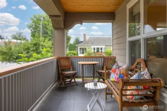 The front sitting porch is south-facing and is the perfect spot for a cup of coffee in the mooring...or a glass of wine in the evening!