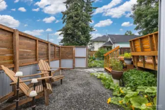 The rear yard is very special and is fully fenced with metal and wood.