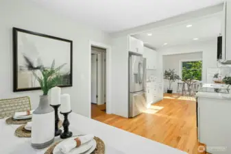 Doorway in photo leads to main floor full bath and main floor bedroom, as well as stairs leading the basement