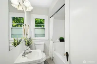Hall full bathroom with laundry chute behind door - you must come visit so you can see it for yourself!