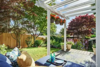 Just outside the family room, you are welcomed by a place to relax and put your feet up after a long day, enjoying the beautiful garden