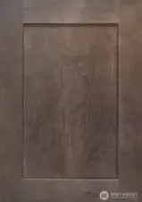 Shaker style Charcoal-stained Maple cabinets throughout