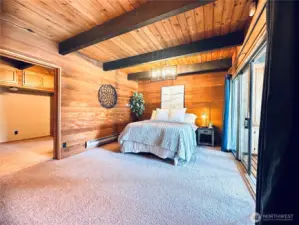 One of two primary bedroom with on-suites with solitude & deck views.