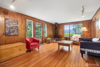 The living room walls are of knotty pine and the contract with that and the fir floors makes this room so cozy and so relaxing.