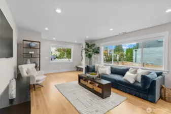 Spacious great room with large windows—perfect for cozy movie nights and effortless entertaining.