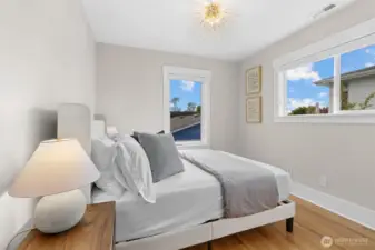 Light-filled and bright, the main-level bedroom offers a serene retreat with plenty of natural sunshine.