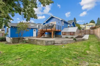 Spacious yard framed by mature trees, offering natural beauty, shade, and exceptional privacy.