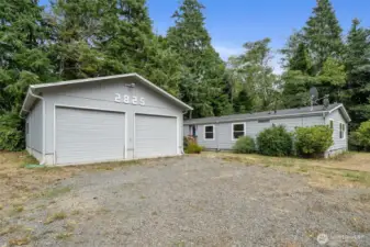 Front of house with detached double car garage