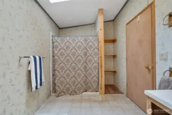 Bathroom with low clearance walk-in shower