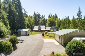 View from entering property, dog run out of sight near right side of house