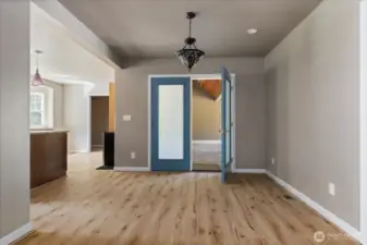 Dining room with French doors to wrap around porch and kitchen to the left