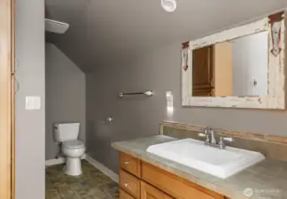 Upstairs bedroom with tiled shower with bathtub