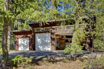 The residential building lot currently features a 1000’ 4-bay garage.